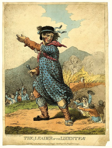 An 1812 engraving: The literally legendary Ned Ludd, leader of the Luddites, stands on a field of battle, before a burning building, wearing a nice dress with polka dots.